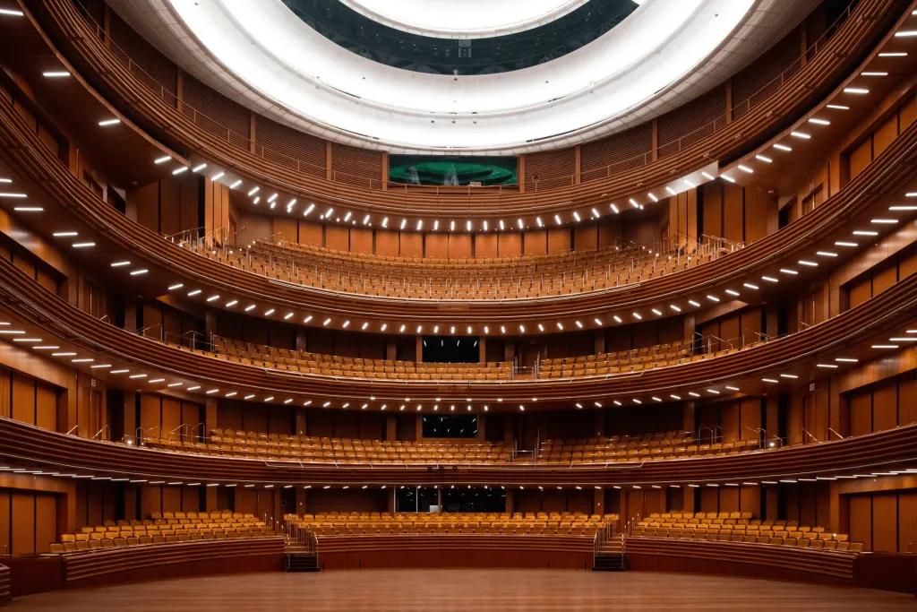 Dr Phillips Center for the Performing Arts Circle theatre coloured brown with theatre chairs and an empty stage.