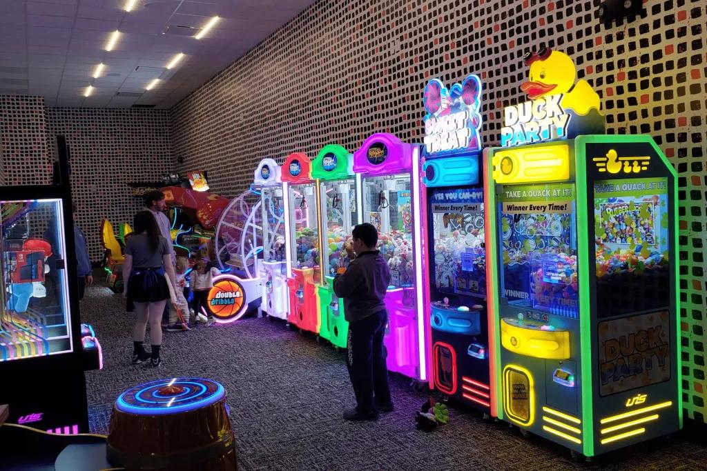 Arcade Tiled rooms with many arcade games lined up multi-coloured.