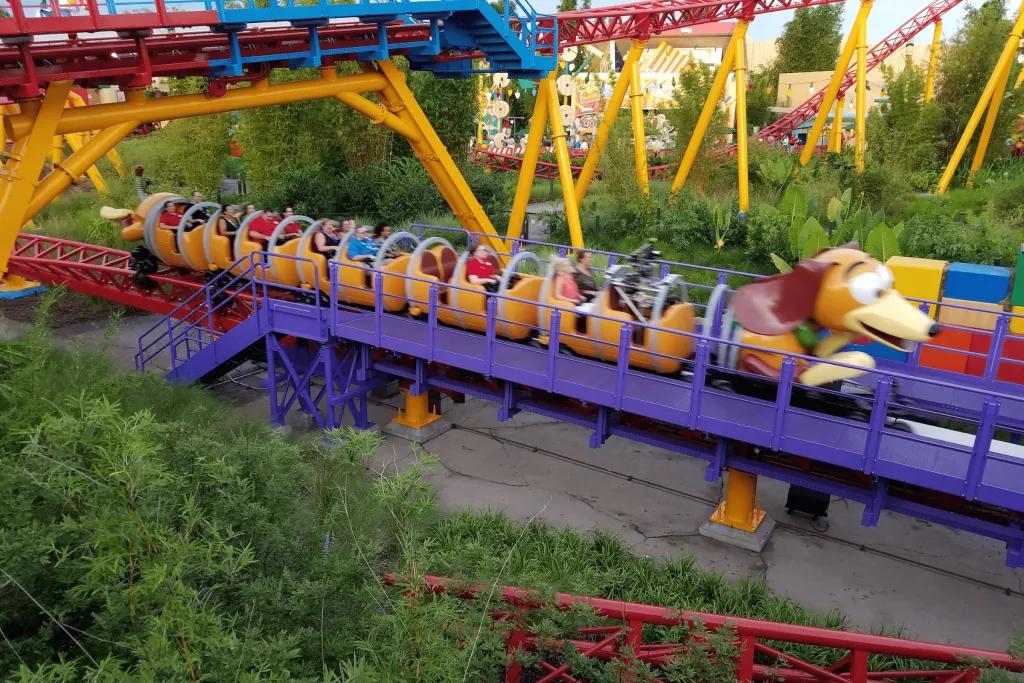 Slinky Dog Dash A dog shaped rollercoaster zooming along the red and yellow tracks