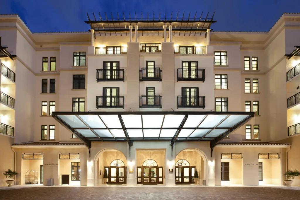 The Alford Inn A large modern, sleek building coloured cream, with a large entrance.
