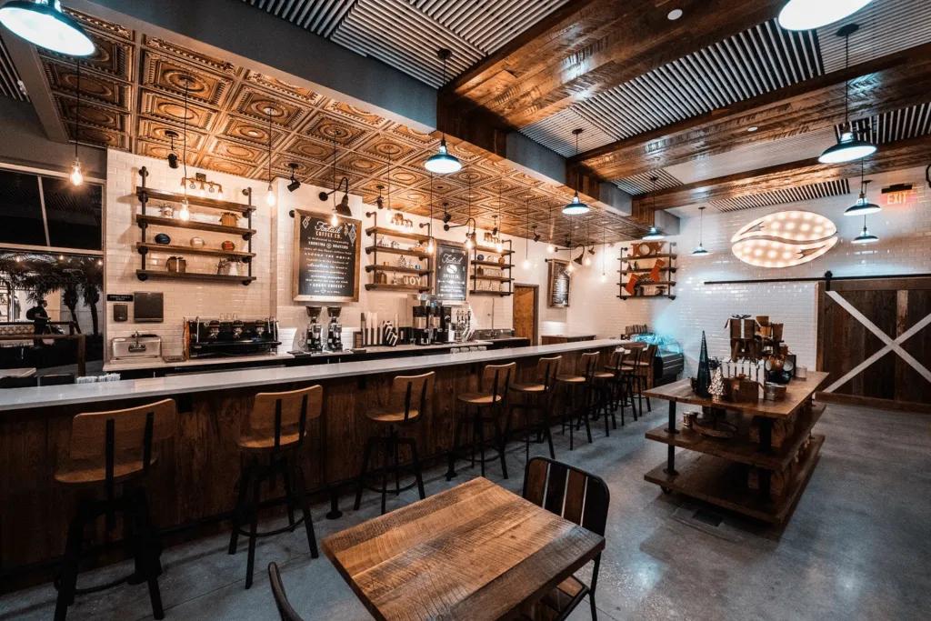 Foxtail Coffee A coffee shop with bar stools and a wooden theme.