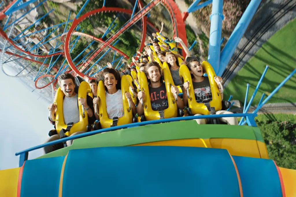 Shambhala Riders in the front row of a rollercoaster about to go under an inversion