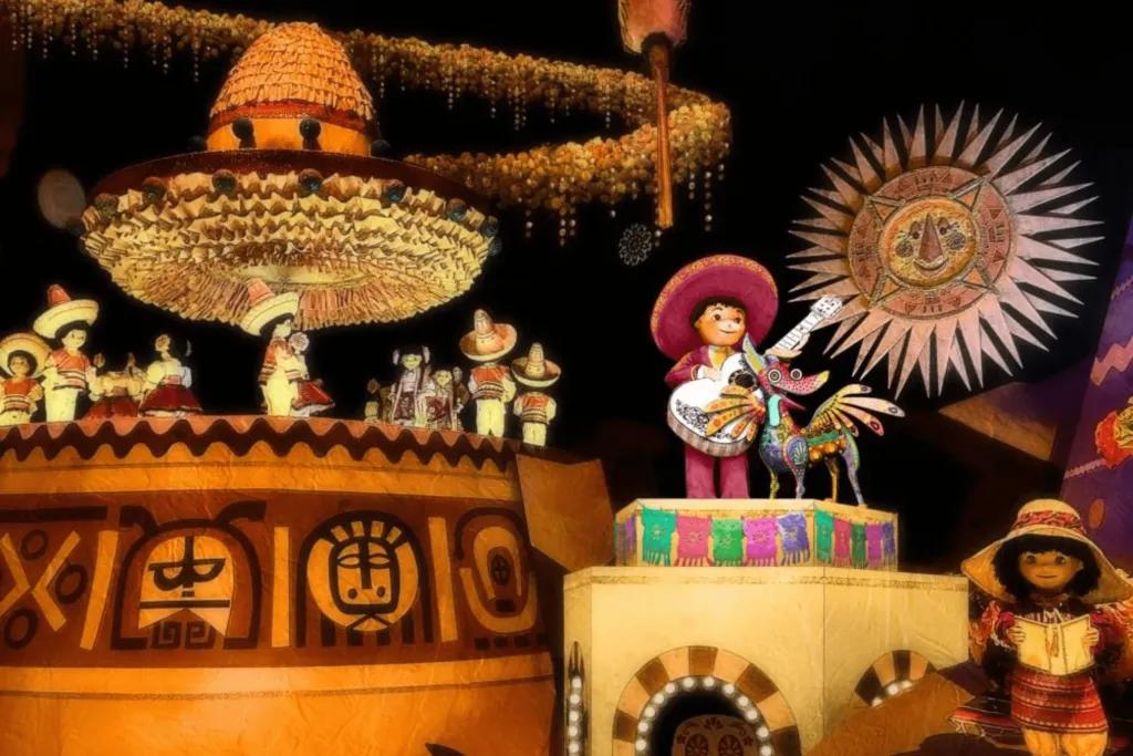 Miguel and Dante from Coco Little dolls of two famous Disney characters, Miguel in a sombrero and suit playing a guitar, and Dante the dog with wings. There are many Mexican cultural references.