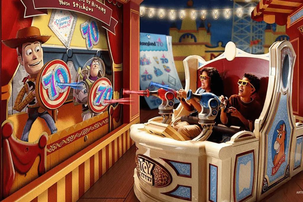Toy Story Midway Mania People sat in circular cars with shooters which target the toys on the screens holding up targets. Instead of the usual targets though, instead it's the 70th anniversary logo.