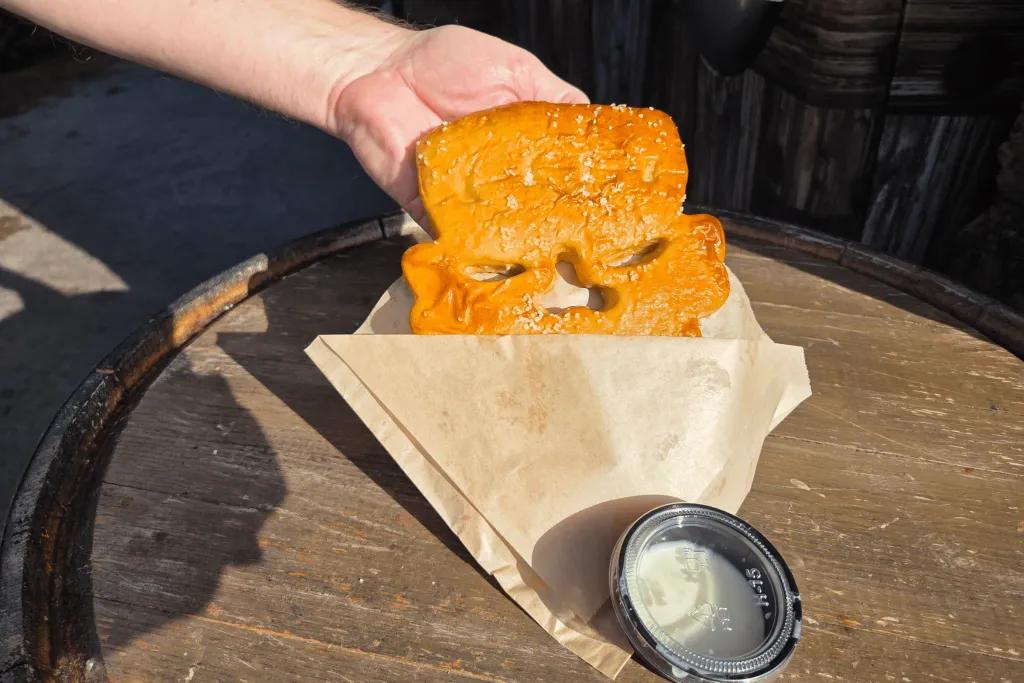 DeLancy’s Cottage Frankenstein head shaped soft pretzel with pot of sauce.