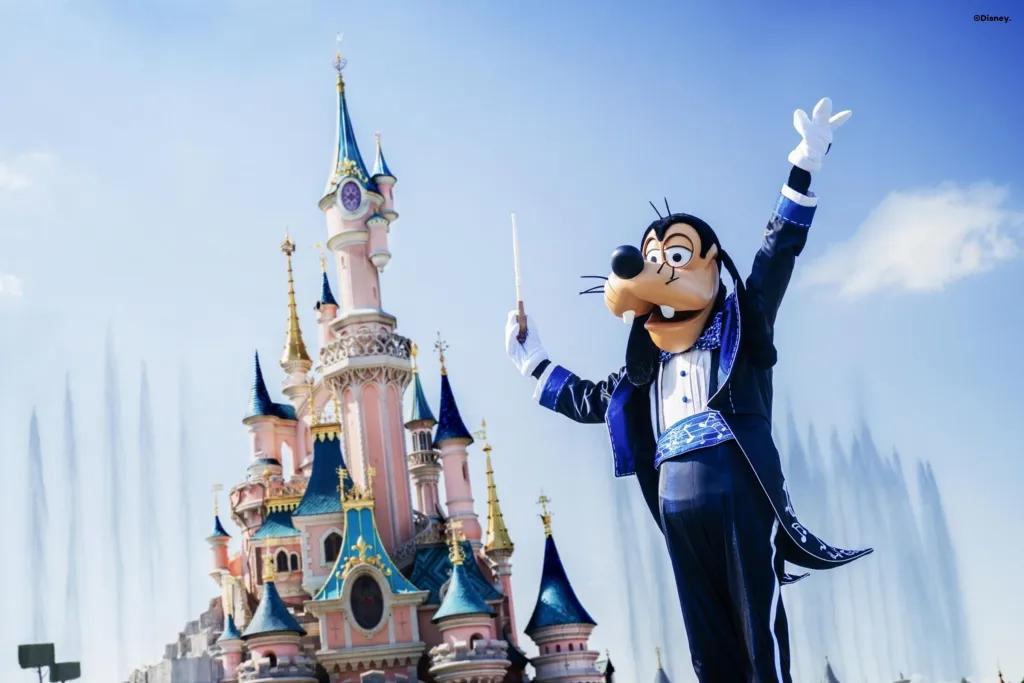 Goofy's Imaginary Orchestra Goofy conducting an orchestra in front of Sleeping Beauty Castle