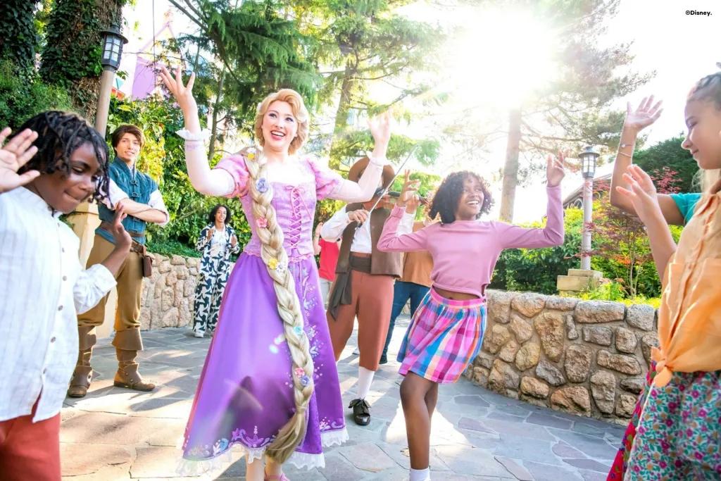 Musical Meet-Up with Rapunzel and Flynn Rapunzel and Flynn Rider dancing with guests in Disneyland
