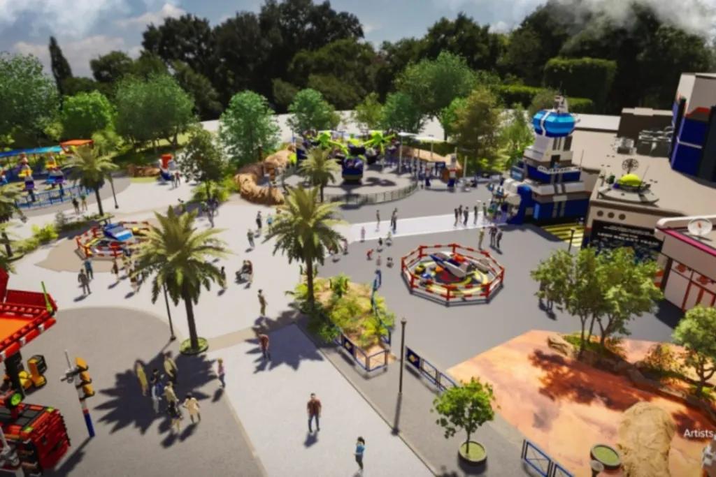 LEGOLAND Florida Artist concept art of large space in theme park with small rides and LEGO statues dotted around.