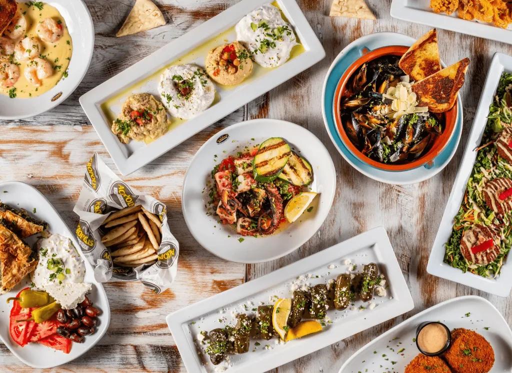 Acropolis Greek Taverna A bird's eye view of a table full of Greek food