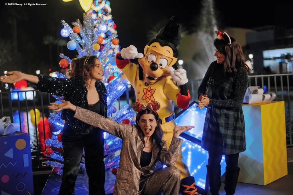 Max Goof at Disney Jollywood Nights Three women posing for a photo with Max Goof dressed as Powerline from A Goofy Movie