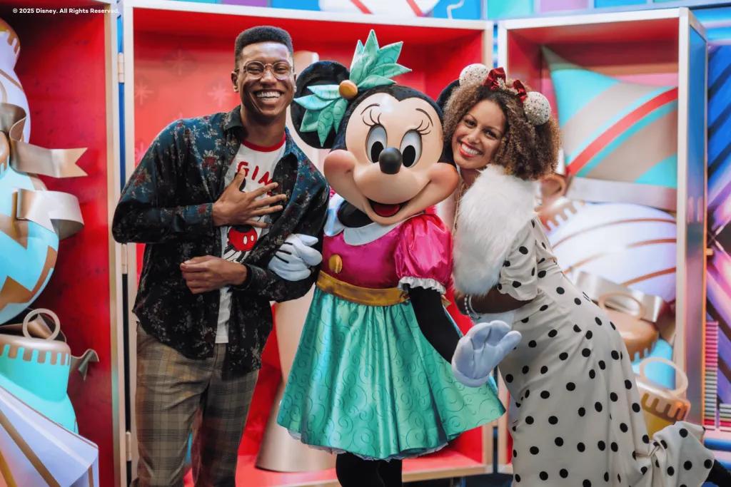 Minnie Mouse at Disney Jollywood Nights A man and woman posing for a photo with Minnie Mouse