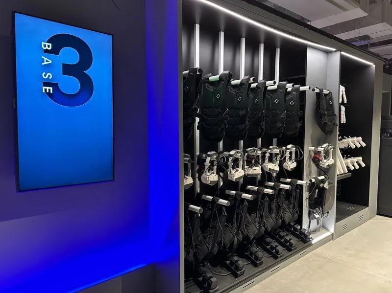 VR Equipment A rack of equipment for a VR experience including vest, headsets and guns