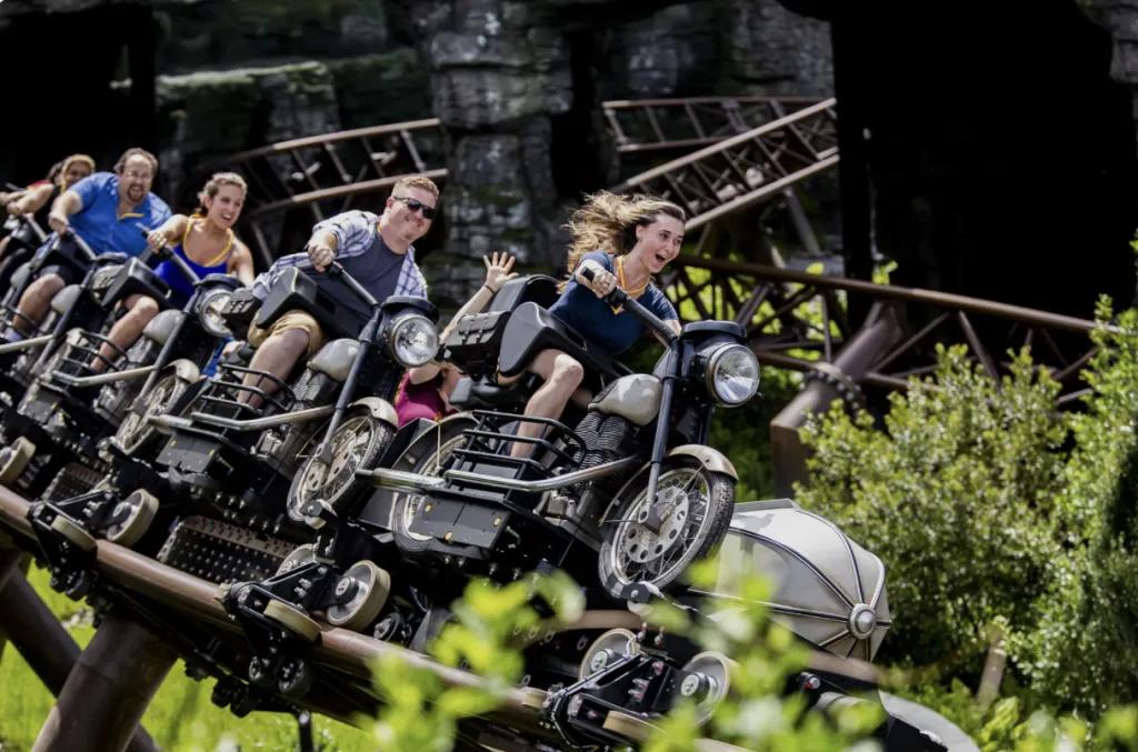 Riders on Hagrid’s Magical Creatures Motorbike Adventure speeding along the track at Universal Islands of Adventure.