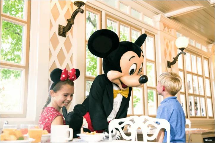Two children enjoying Character Dining at Disneyland Paris