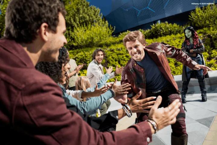 A Character Encounter staff interacting with a family at Disneyland Paris