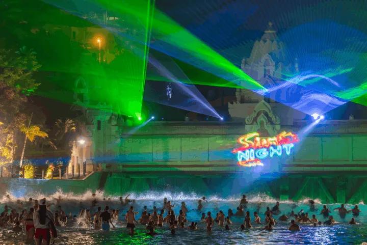People dancing in a pool at Siam Night, Siam Park