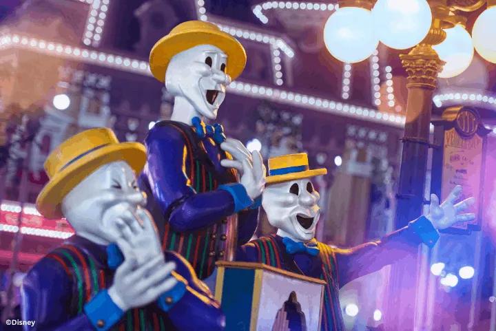 Filename: skeleton-performers-parade-halloween-festival.jpg  Alt text: Skeleton-faced performers in blue and gold costumes singing during a parade at the Disney Halloween Festival