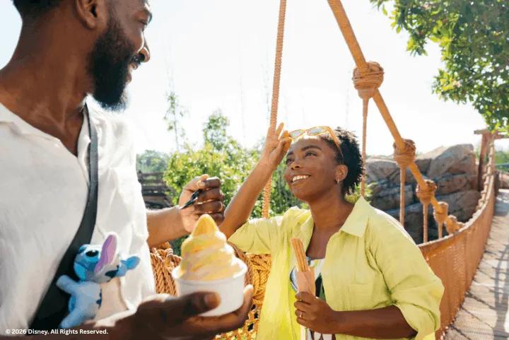 Guests eating the Dole Whip at Magic Kingdom Park