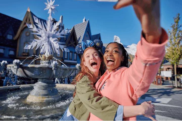 Two friends taking a selfie by the fountain in Arendelle, World of Frozen