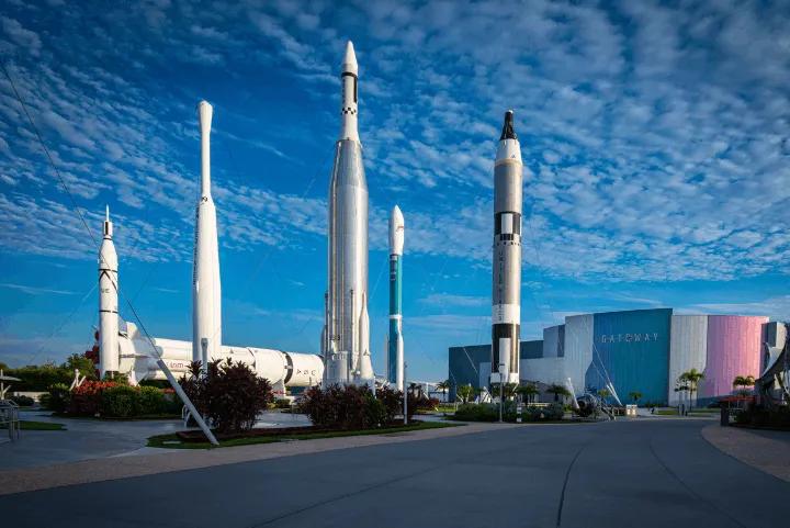 Display of vertical rockets outdoors with the Gateway building in the background