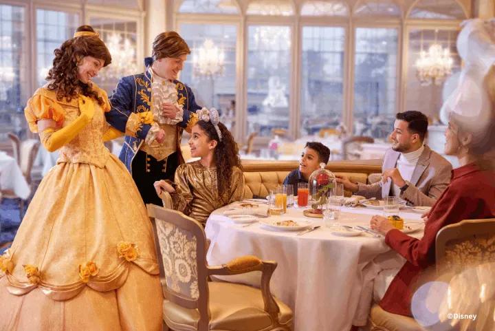 Princess Belle and the Beast visiting a family at their dining table