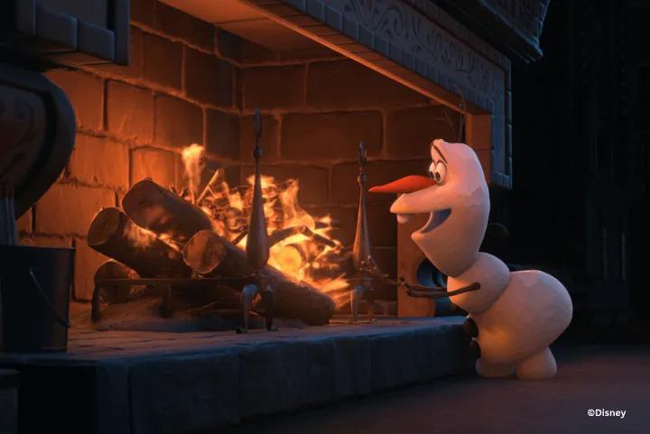 Olaf the snowman warming his hands in front of a glowing fireplace hearth