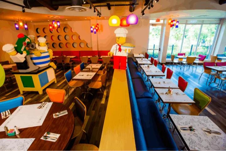 Dining area at Bricks Family Restaurant inside LEGOLAND® Hotel Florida with LEGO chef figures and colorful decor