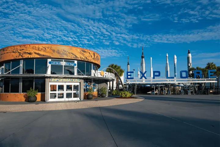 The information building and explore entrance sign at the Kennedy Space Center Visitor Complex