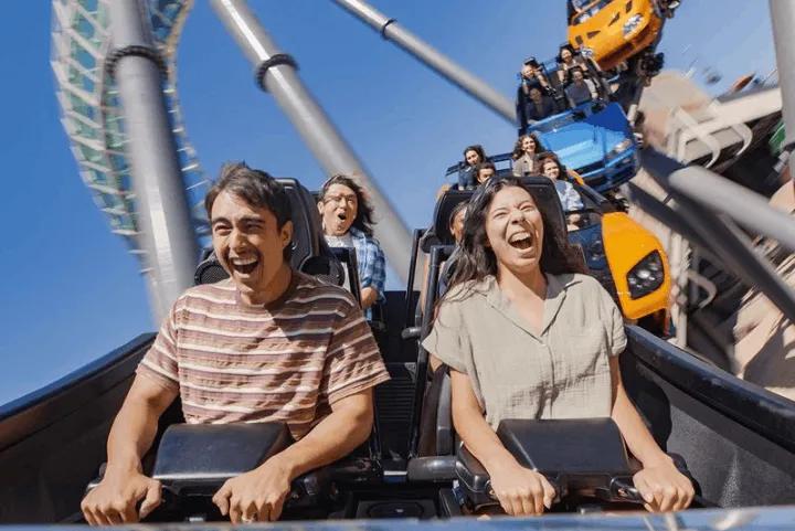 Guests screaming and laughing while riding the Fast & Furious: Hollywood Drift roller coaster