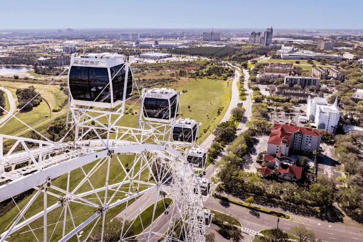 An aerial view of the Orlando Eye observation wheel overlooking the city