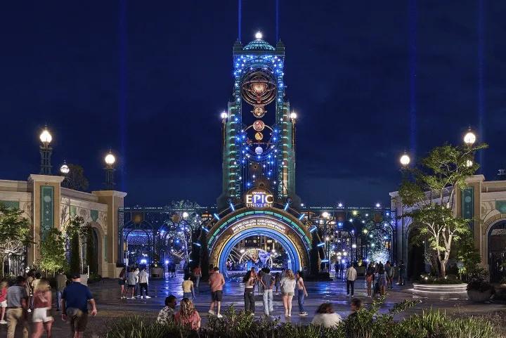 The illuminated entrance portal to Universal Epic Universe at night