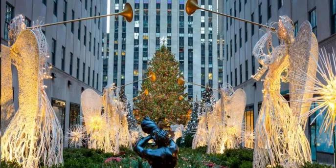 Christmas in New York City Glowing angel decorations in front of the Rockefeller Center Christmas Tree