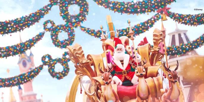 Santa Claus at Disney Enchanted Christmas Santa Claus on a parade float being pulled by mechanical reindeer, with Mickey Mouse wreaths and Sleeping Beauty Castle in the background