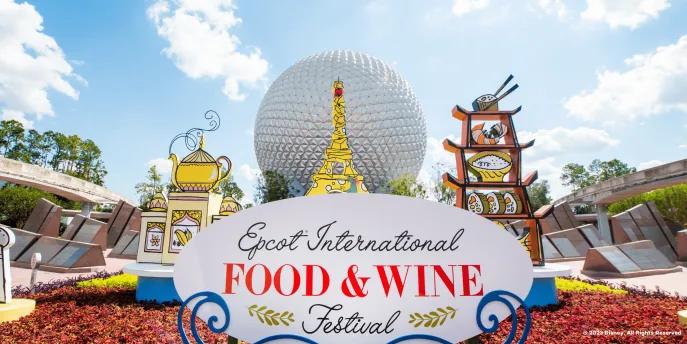 EPCOT International Food and Wine Festival 2023 A sign reading "EPCOT International Food and Wine Festival" in front of Spaceship Earth