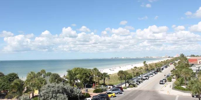 Florida Beaches A view down a road running along a white sandy beach and blue ocean