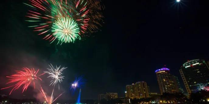 Downtown Orlando Fireworks in the sky bursting over Downtown Orlando high rise buildings.