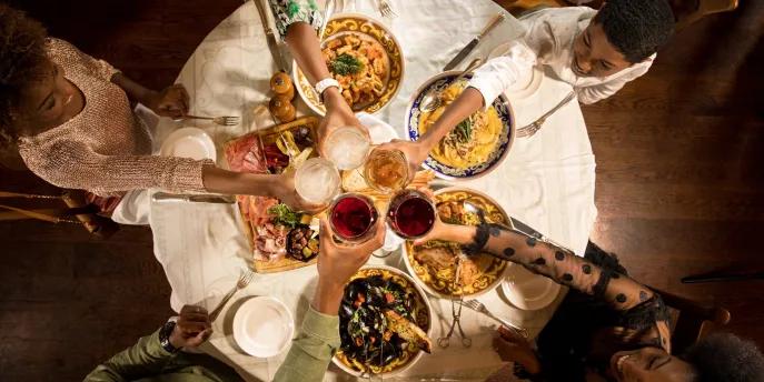 Orlando Magical Dining A bird's eye view of a family sat round a table cheersing their drinks