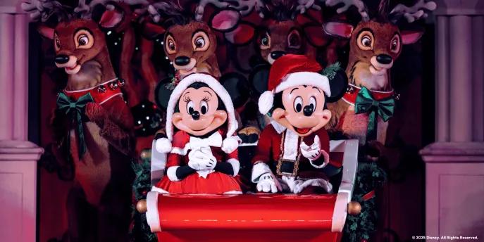 Mickey’s Most Merriest Celebration Mickey and Minnie in Santa outfits on a sleigh in front of reindeer