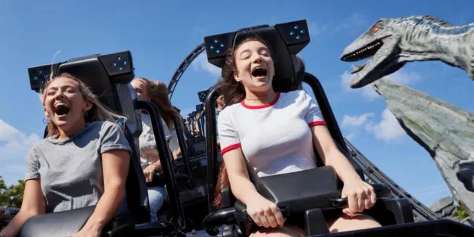 Guests laughing and screaming with excitement on the Jurassic World VelociCoaster at Universal Orlando Resort, one of the top attractions in Orlando.