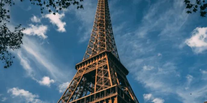 A view looking up at the Eiffel Tower in Paris