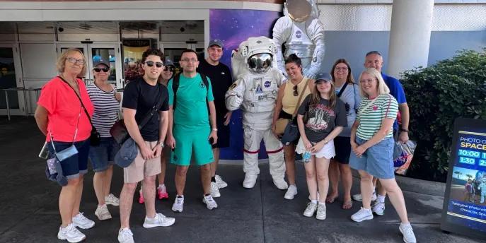 Group taking photo with an astronaut