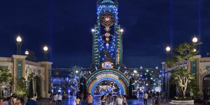 The illuminated entrance portal to Universal Epic Universe at night