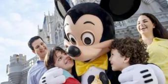 children hugging mickey mouse