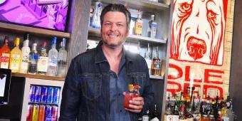 Blake Shelton at Ole Red Blake Shelton holding a glass of sangria behind a bar