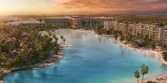 Concept art of a hotel surrounding a beach and lagoon