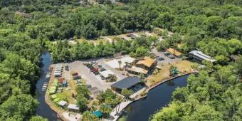An aerial view of a recreation centre surrounded by a water way used for watersports