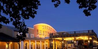 The front entrance of Disney Hotel Cheyenne designed to look like a wild-west stable