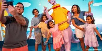 A family posing with a large purple dragon while taking a selfie