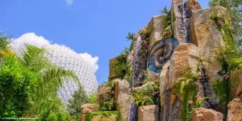 A rock formation with the Heart of Te Fiti at its centre with Spaceship Earth in the background