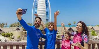 Family taking selfie in front of Burj al Arab, Wild Wadi Waterpark in Dubai